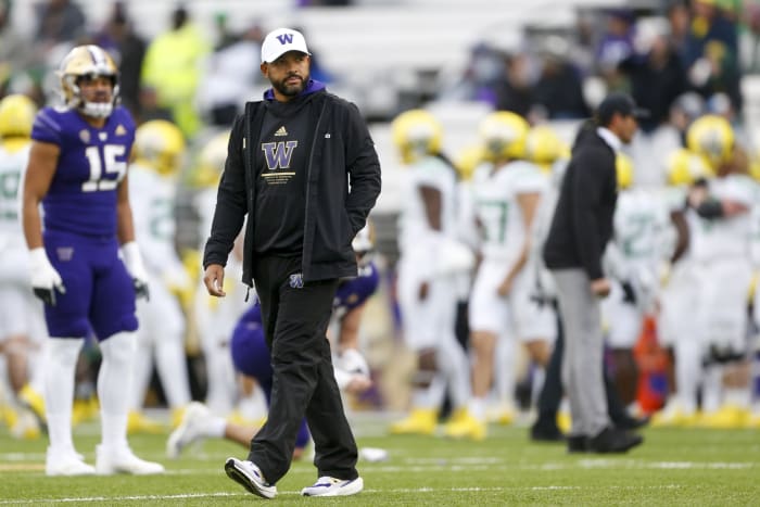 Nov 6, 2021; Seattle, Washington, USA; Washington Huskies head coach Jimmy Lake watches pregame warmups against the Oregon Ducks at Alaska Airlines Field at Husky Stadium.